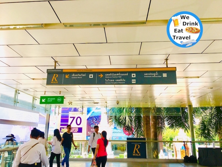 Ratchaprasong Walk sign pointing to Platinum Fashion Mall and other landmarks nearby in Bangkok, Thailand.